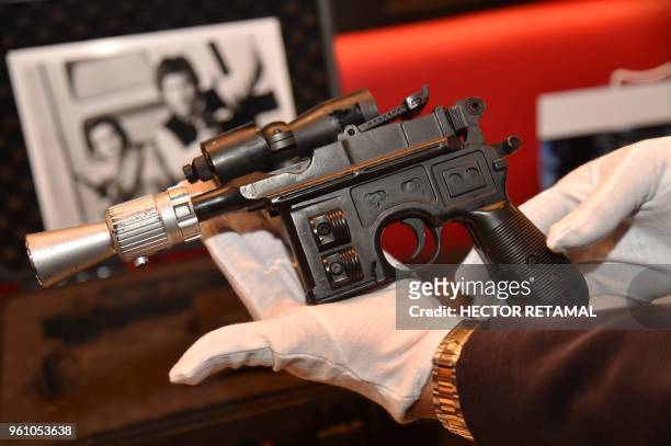 Star Wars' Han Solo's BlasTech DL-44 blaster is exhibited by Julien's Auctions at Planet Hollywood, in New York, on May 21, 2018. - The auction will...