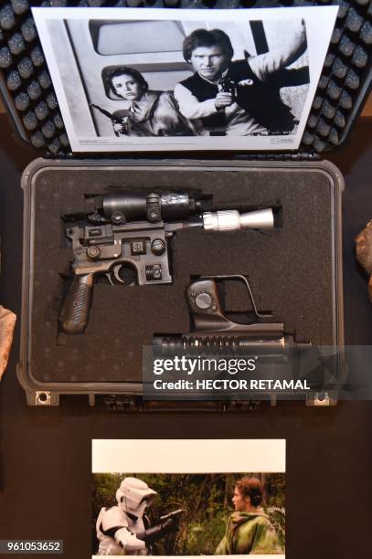 Star Wars' Han Solo's BlasTech DL-44 blaster is exhibited by Julien's Auctions at Planet Hollywood, in New York, on May 21, 2018. - The auction will...