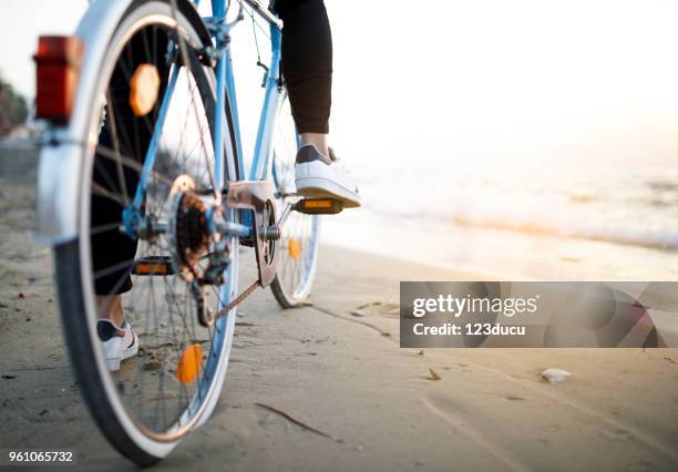 young man with bike - retro summer holiday stock pictures, royalty-free photos & images