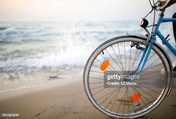 young man with bike - 123ducu stock pictures, royalty-free photos & images