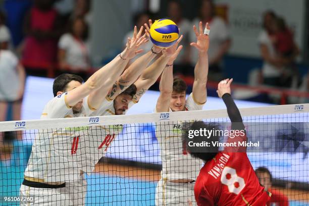 Masahiro Yanagida of Japan and Antoine Brizard, Nicolas Le Goff and Thibaut Rossard of France during the Volleyball Men's Nations League match...