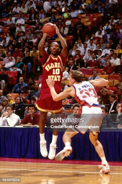Sam Cassell of Florida State shoots the ball against Syracuse during the ACC-Big East Challenge on December 3, 1991 at the Omni Coliseum in Atlanta,...