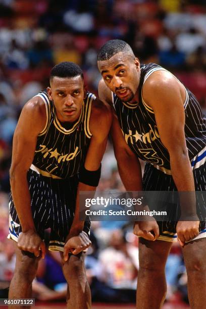 Anfernee Hardaway and Dennis Scott of the Orlando Magic look on during the game against the Atlanta Hawks on February 2, 1994 at the Omni Coliseum in...