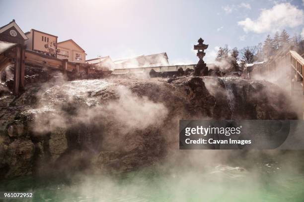 cottages overlooking kusatsu onsen hot spring - gunma stockfoto's en -beelden