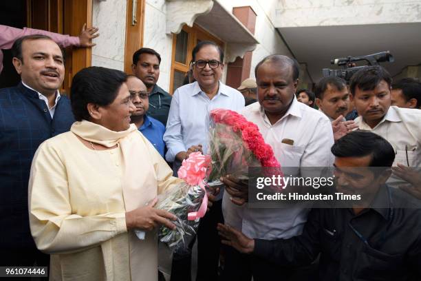 Leader H. D. Kumaraswamy, who is all set to take over as the 24th Karnataka Chief Minister on May 23, is welcomed by Bahujan Samaj Party Chief...