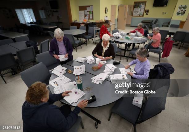 Volunteers working to get the paper out prepare for shipment at the Abington Council on Aging in Abington, MA on April 25, 2018. Print journalism is...