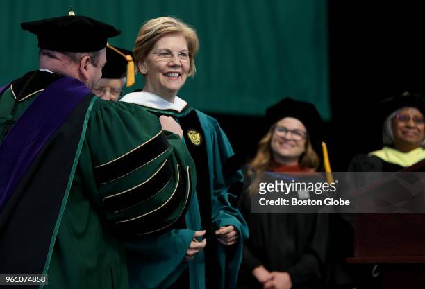 Jeff A. Weiss, left, President of Lesley University, stands with U.S. Senator Elizabeth Warren during the honorary degree presentation to the Senator...