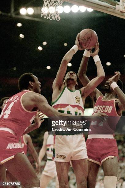 Alex English of the Denver Nuggets goes to the basket against the Houston Rockets circa 1982 at McNichols Sports Arena in Denver, Colorado. NOTE TO...