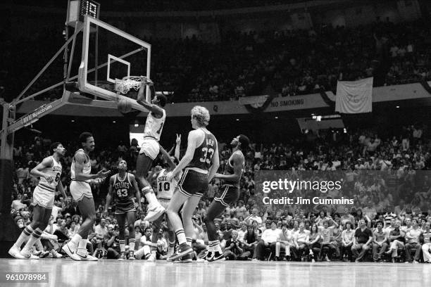 Caldwell Jones of the Philadelphia 76ers dunks the ball against the Boston Celtics circa 1982 at The Spectrum in Philadelphia, Pennsylvannia. NOTE TO...