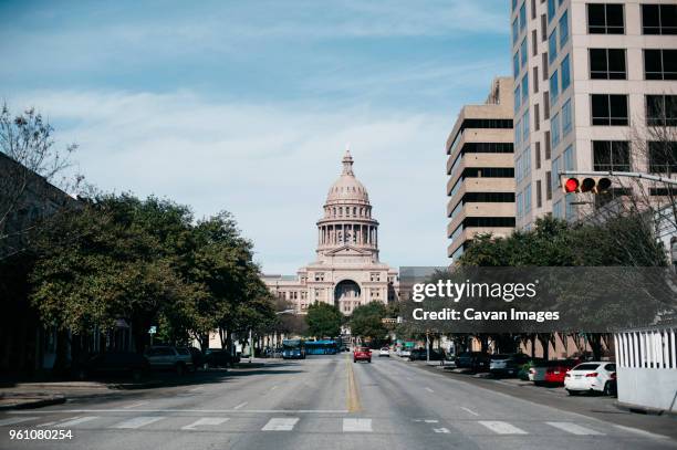 texas state capitol against blue sky - austin texas city stock pictures, royalty-free photos & images