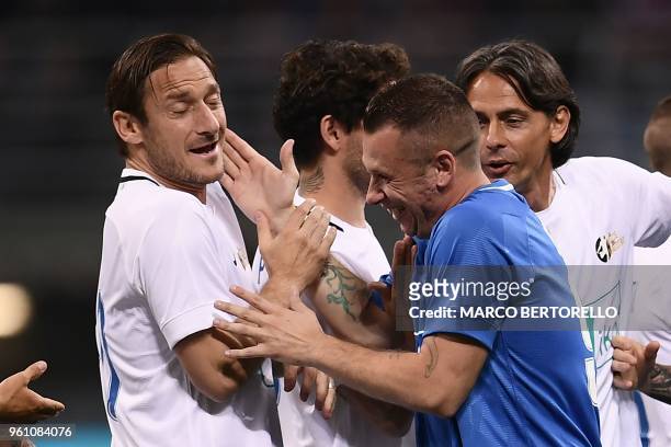 Former Italian football players Francesco Totti and Antonio Cassano joke during the "Notte del Maestro" , a football match celebrating the end of...