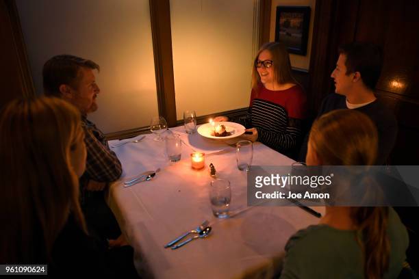 Listening to a chorus of Happy Birthday Emily Murray 20, a junior at CU Boulder celebrates her 20th birthday with her foster family, Marcus Pennell...