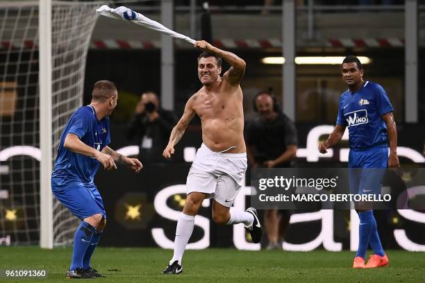 Former Italian football player Christian Vieri celebrates after scoring a goal during the "Notte del Maestro" , a football match celebrating the end...