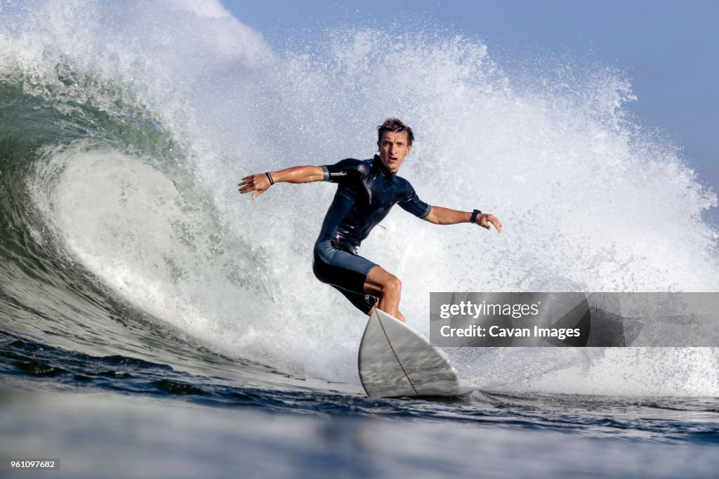 Low angle view of man surfing on sea