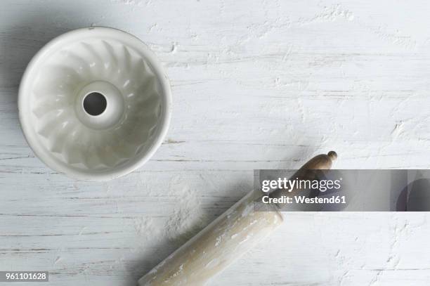 gugelhupf baking dish and rolling pin - baking dish stock pictures, royalty-free photos & images