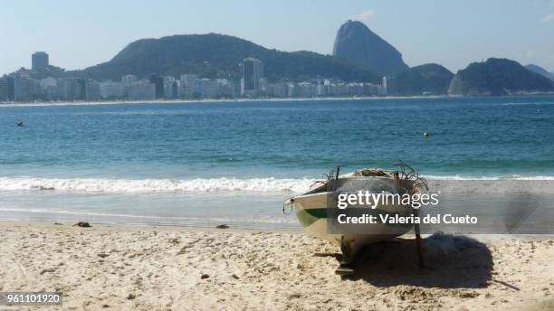boat in the sand in copacabana - valeria del cueto stock pictures, royalty-free photos & images