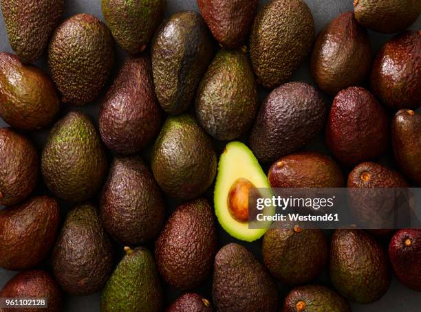 whole and sliced avocado - avocado bildbanksfoton och bilder