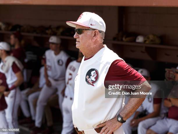 Head Coach Mike Martin of the Florida State Seminoles in the dugout before being honored as college baseball's all-time winningest coach prior to the...