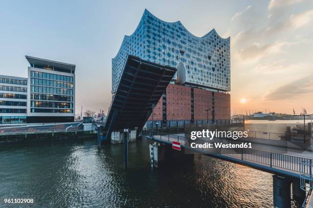 germany, hamburg, opened bridge am kaiserkai, elbe philharmonic hall at sunset - elbphilharmonie stock pictures, royalty-free photos & images