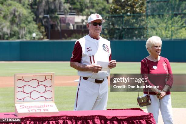 Head Coach Mike Martin of the Florida State Seminoles and his wife, Carol, poses next to a gift box created by NIKE to commemorate the all-time...