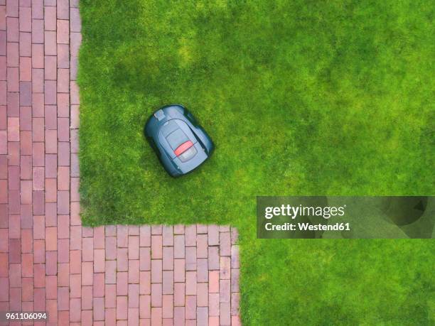 germany, bavaria, robotic lawn mower on meadow - brick pathway stock pictures, royalty-free photos & images