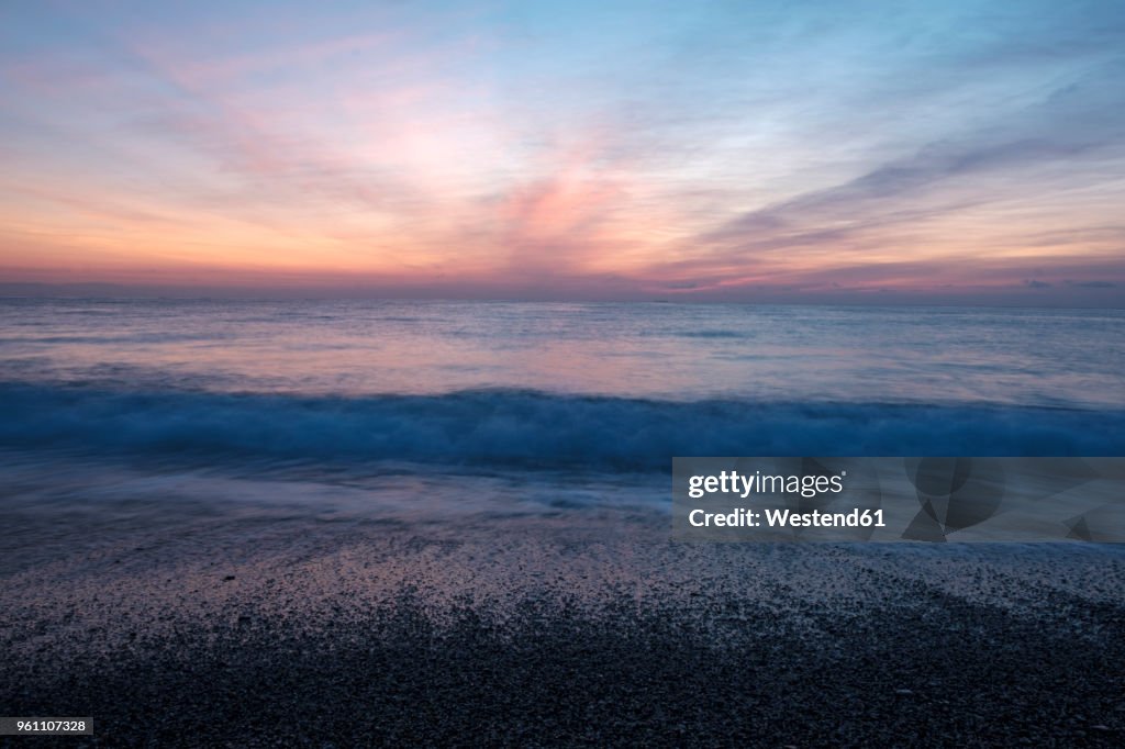 Italy, Liguria, Riviera di Ponente, Gulf of Genoa, Noli, sunrise at beach