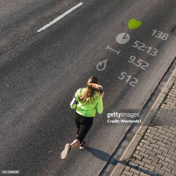 young woman running on a street with data - duration of training stock pictures, royalty-free photos & images