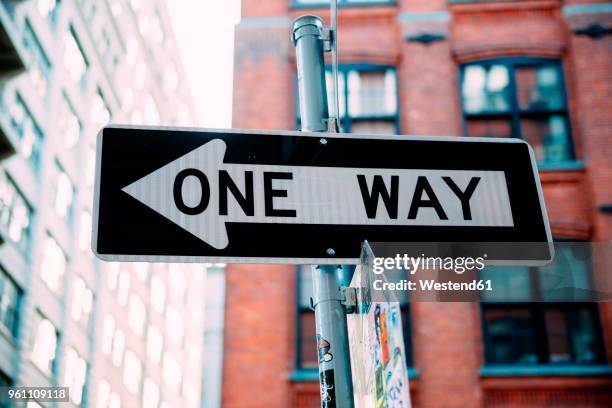 usa, new york city, one way sign - one way stock pictures, royalty-free photos & images
