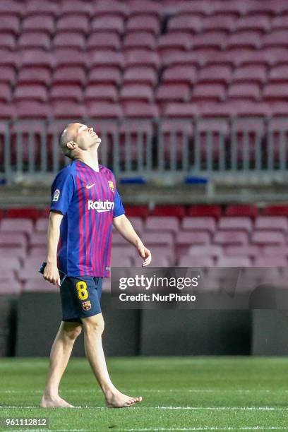 Barcelona midfielder Andres Iniesta alone in the grass of Camp Nou says goodbye to the stadium after playing his last game with FC Barcelona. After...