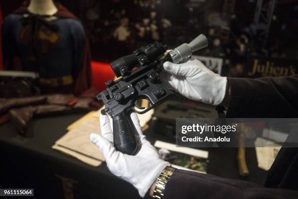 Star Wars' Han Solo's BlasTech DL-44 blaster press previewed by Julien's Auctions on May 21, 2018 at Planet Hollywood in New York, United States. The...