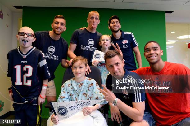 New England Revolution Matt Turner, Cody Cropper, Nicolas Samayoa, Kriztian Nemeth, and Brandon Bye pose for a picture with Jack, Thomas, and...