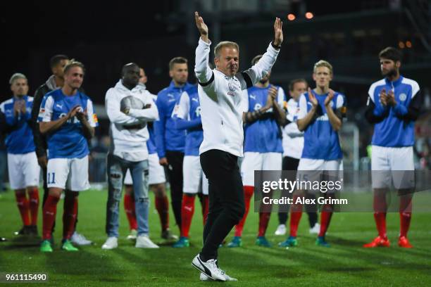 Head coach Markus Anfang of Kiel waves farewell to the fans after the Bundesliga Playoff Leg 2 match between Holstein Kiel and VfL Wolfsburg at...