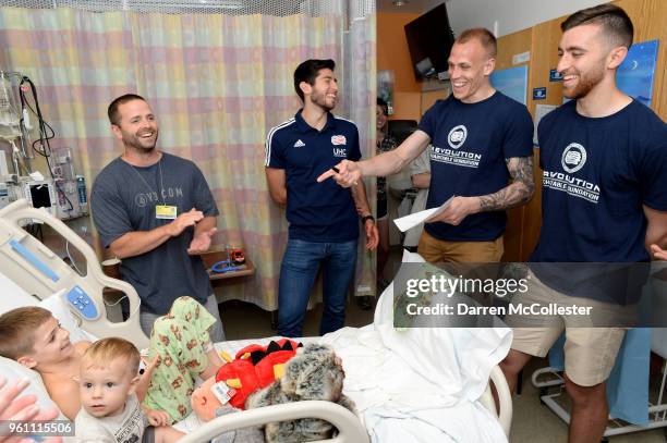 New England Revolution Nicolas Samayoa, Cody Cropper, and Matt Turner visit with Vladimir and Vitali at Boston Children's Hospital on May 21, 2018 in...