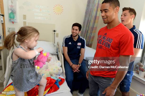 New England Revolution Nicolas Samayoa, Kriztian Nemeth, and Brandon Bye visit with Macy at Boston Children's Hospital on May 21, 2018 in Boston,...