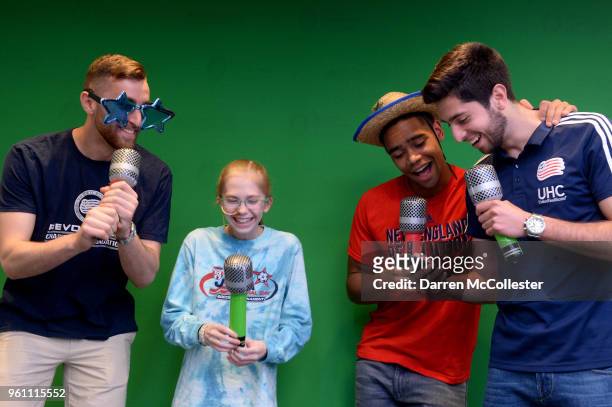 New England Revolution Matt Turner, Brandon Bye, and Nicolas Samayoa lip sync with Caroline at Boston Children's Hospital on May 21, 2018 in Boston,...