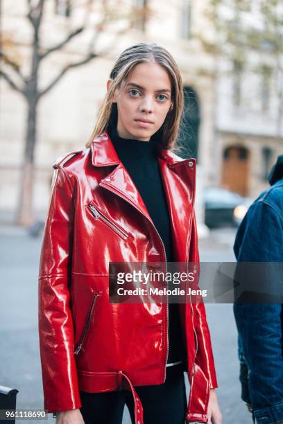 Mexican model Mariana Zaragoza wears a red patent leather jacket and black sweater after the John Galliano show at Lycee Carnot on October 02, 2016...