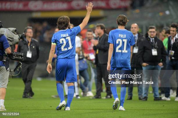 Andrea Pirlo and son Nicolo wave as they leave the field after the Andrea Pirlo Farewell Match at Stadio Giuseppe Meazza on May 21, 2018 in Milan,...