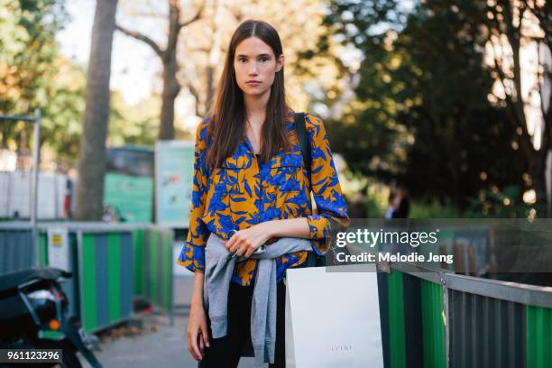 Model Johanna Defant wears an orange and blue floral top after the Ellery show at Palais de Tokyo on October 04, 2016 in Paris, France