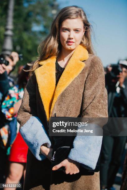 Lindsey Wixson wears a multi-colored Saks Potts fur coat after the Chanel show at Grand Palais on October 04, 2016 in Paris, France.