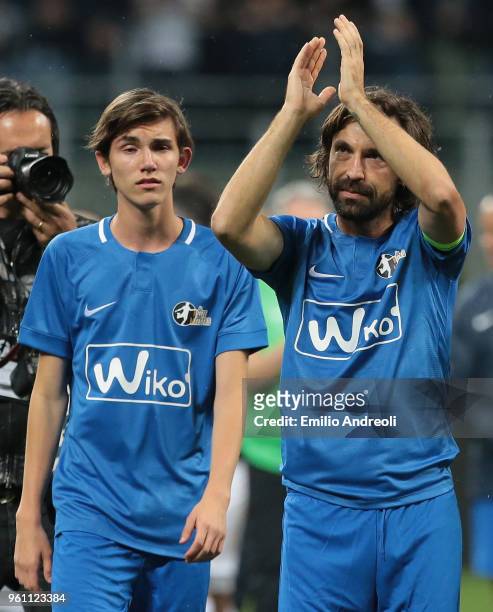 Andrea Pirlo greets the fans with his son at the end of Andrea Pirlo Farewell Match at Stadio Giuseppe Meazza on May 21, 2018 in Milan, Italy.