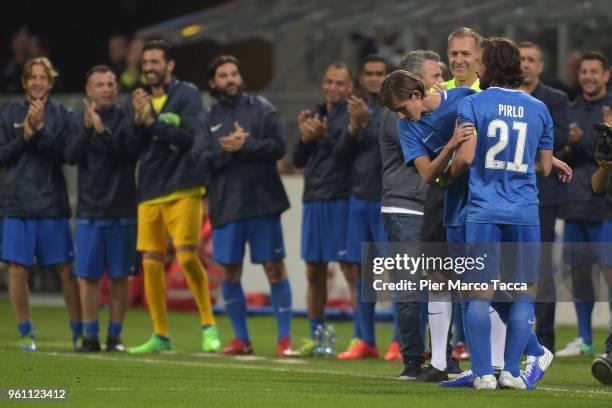 Andrea Pirlo leaves the field, his son Nicolo enters during Andrea Pirlo Farewell Match at Stadio Giuseppe Meazza on May 21, 2018 in Milan, Italy.
