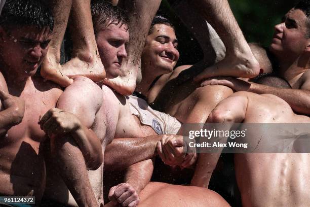 Members of the freshman class participate in the annual Herndon Monument Climb May 21, 2018 at the U.S. Naval Academy in Annapolis, Maryland. The...