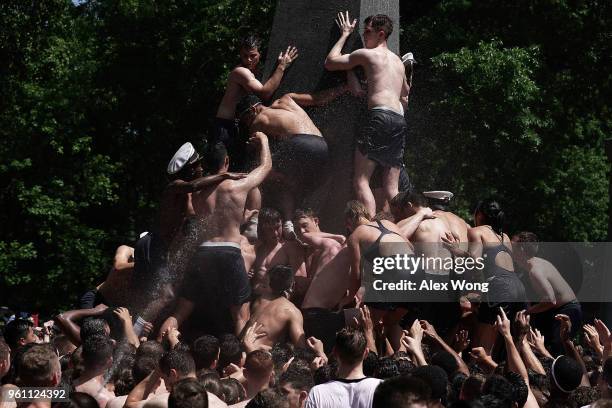 Members of the freshman class participate in the annual Herndon Monument Climb May 21, 2018 at the U.S. Naval Academy in Annapolis, Maryland. The...