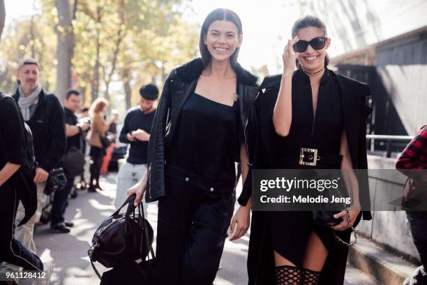 Top models Georgia Fowler, Sara Sampaio share a laugh after the Miu Miu show at Palais d'Iena on October 05, 2016 in Paris, France. Both models wear...