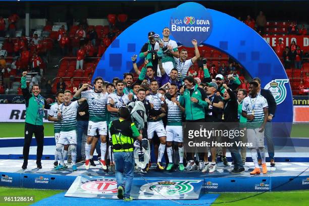 Carlos Izquierdoz of Santos holds the Championship Trophy with teammates after the Final second leg match between Toluca and Santos Laguna as part of...