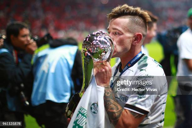 Brian Lozano of Santos Laguna kisses the Championship Trophy after the Final second leg match between Toluca and Santos Laguna as part of the Torneo...