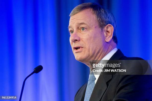 Supreme Court Chief Justice John Roberts speaks before presenting US Supreme Court Justice Ruth Bader Ginsburg the American Law Institute's Henry J....