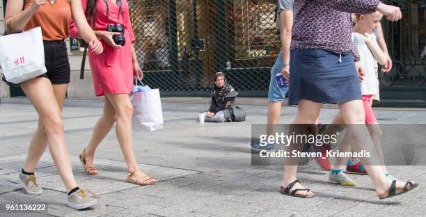 poverty on the champs elysees - beggar stock pictures, royalty-free photos & images