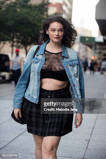 Model Jennie Runk wears a denim jacket, sheer bra top, and plaid skirt during New York Fashion Week Spring/Summer 2018 on September 8, 2017 in New...