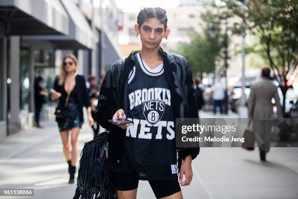 Model Somalia Knight wears a Brooklyn Nets jersey and fringe purse during New York Fashion Week Spring/Summer 2018 on September 8, 2017 in New York...